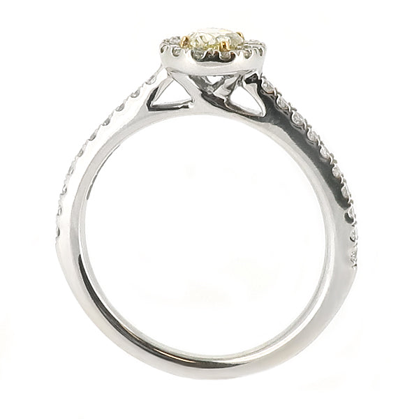 Oval yellow diamond and diamond halo cluster ring in platinum and 18ct gold